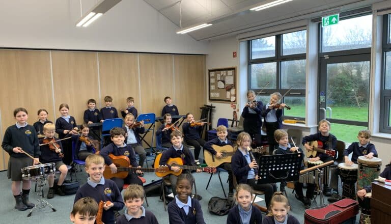 William gives KS1 a guitar demonstration